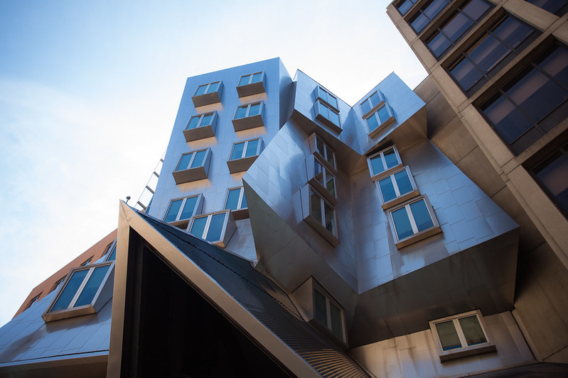 Photo of MIT's Stata Center which features a metallic facade and walls and windows at odd geometric angles