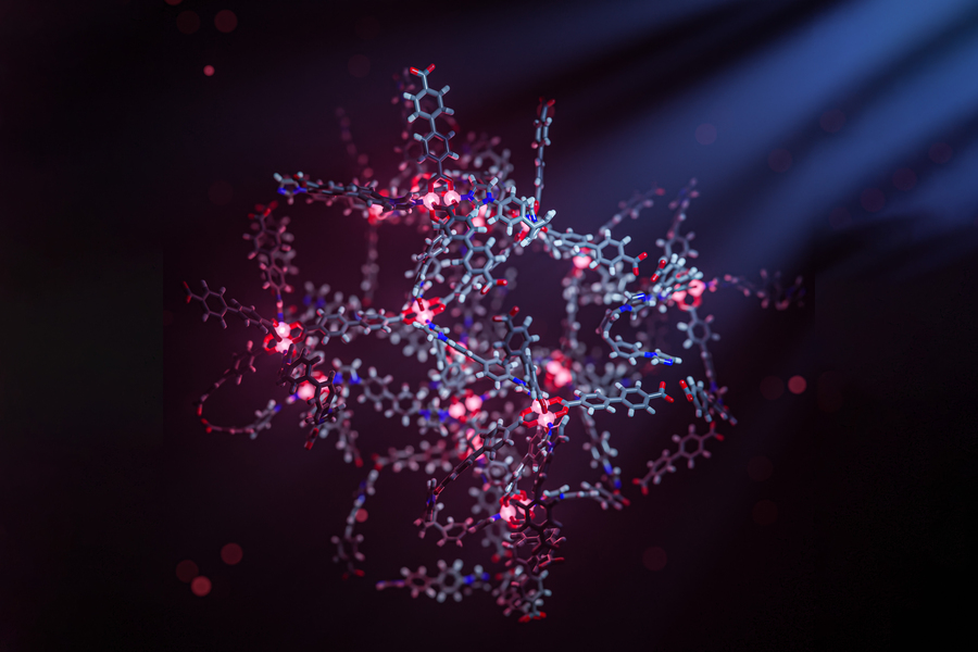 A 3D rendering of a MOF made of metal and organic molecules, in the general shape of a loose, hollow, ball. The MOF is made of glowing pink orbs and grey hexagon-shaped bits that connect to red and blue bits.
