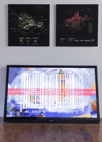 Computer data on a screen against a wall; above it are two data screenshots, side by side..