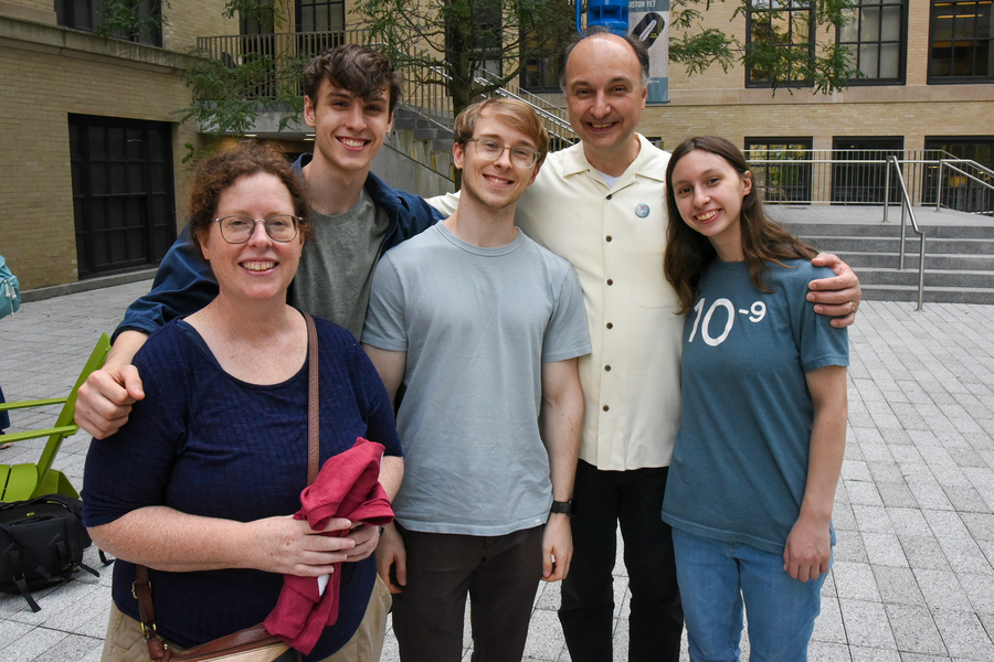A family of five poses for the camera