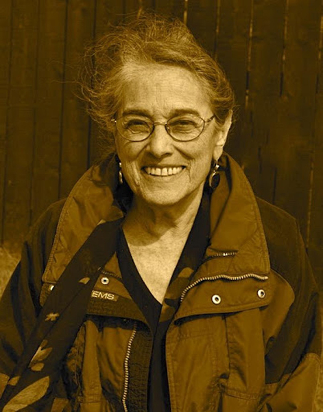 Evelyn Fox Keller smiles and wears a sporty outdoors jacket. 