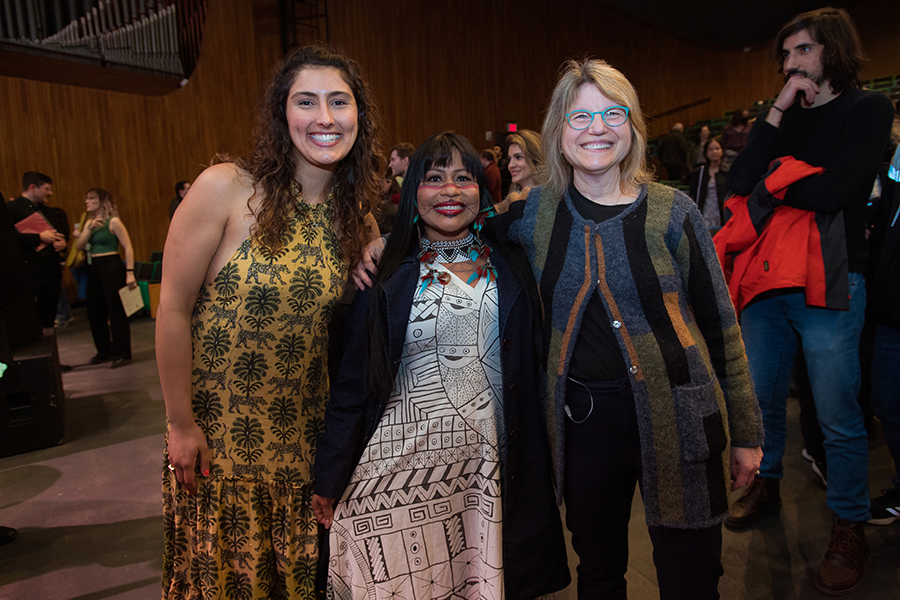 Three women pose for a photo.