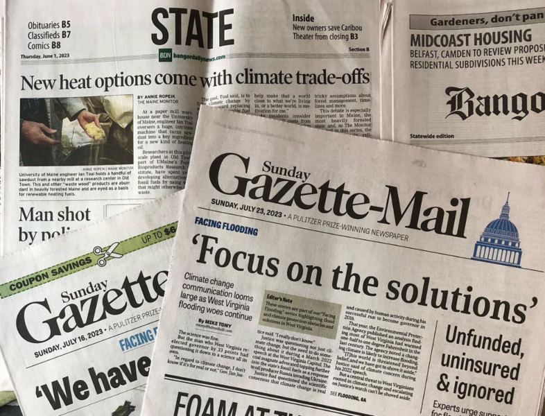 Photo of the partial front pages of four newspapers