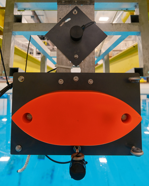 Three types of echosounders are lowered into an engineering test tank