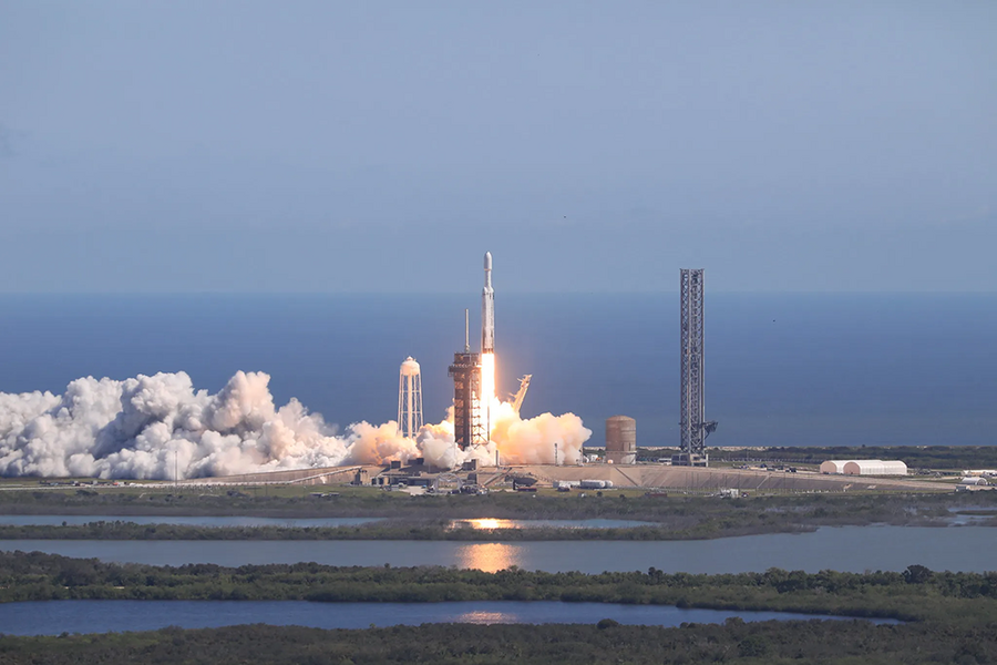 A large rocket lifts off from a NASA launchpad next to Florida's Atlantic coast