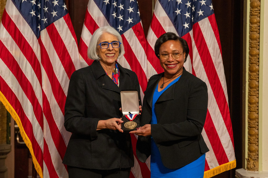 Arati Prabhakar and Paula Hammond pose together with a medal, in front of a U.S. flag Caption: Arati Prabhakar awards Institute Professor Paula Hammond ’84, PhD ’93 the National Medal of Technology and Innovation on Jan. 3.