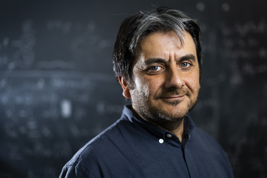 Headshot of Cem Tasan.