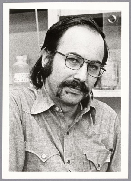 Greyscale headshot of a young David Baltimore