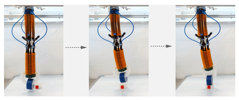 Three photos of a cylindrical, jointed robot arm with a soft gripper manipulating an object about the size and shape of a roll of tape