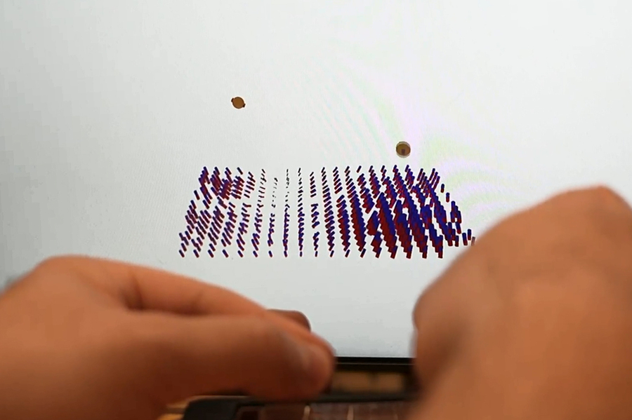 A computer screen shows how the beads are tracked.