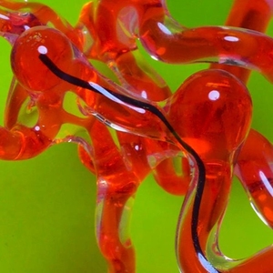 black wire through red colored passages. 