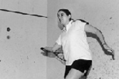 Amalia Londono, a member of the men's varsity squash team, gets ready to take a shot.