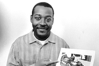 Ronald Demon shows a picture of the frame of the "smart shoe" he developed and patented. Computer chips would be attached to the frame and then a leather or canvas covering would be added to finish the shoe in the desired style.