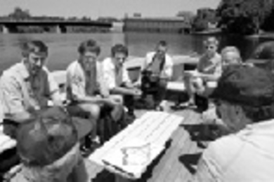 Students and scientists from the Universitat Politcnica de Catalunya (UPC) and MIT survey a map of the area by the Northern Canal Gatehouse, built in 1848 on the Merrimack River in Lowell, MA. Left to right: Professor Joaquin Sabat, research scientist Pere Vall and graduate student Dani Catalayud of the UPC; Carlos Anglada, Office of Technical Cooperation, Diputaci de Barcelona; MIT architecture g...