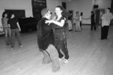 Graduate student Rif Rifkin and Jackie Willbur, a sophomore in economics, trip the light fantastic at an IAP ballroom dancing class.
