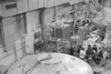 Participants in the Plasma Science and Fusion Center's IAP Open House hear about the Levitated Dipole Experiment (foreground), a new approach to nuclear fusion.