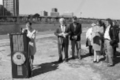 Officials from environmental organizations and MIT recently gathered on the banks of the Charles River to mark progress by the Clean Charles 2005 Coalition toward a swimmable and fishable river within five years. Speakers included Mindy S. Lubber (at podium), regional administrator at the EPA's New England office; Paul Parravano (second from left), co-director of MIT's Office Of Government and Com...