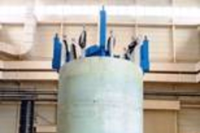 The inner module of a superconducting magnet built by the US team (top), with magnet team members including Rui Vieira of MIT (far left); and the outer module built by the Japanese team (center picture). Bottom image is a cutaway drawing of the full assembly of both modules combined with the structure provided by the US.