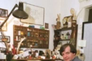 Calligrapher Tom Costello at the drawing board.