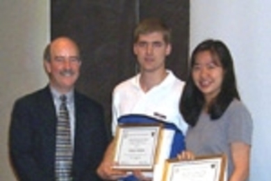 Michael J. Buchanan and Caroline P. Chen receive their Outstanding TA Awards from Professor Robert C. Armstrong (left), head of chemical engineering.