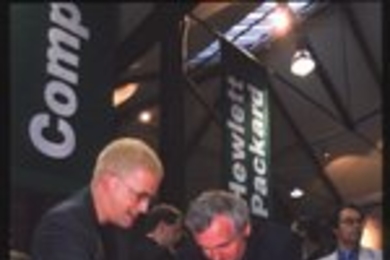Media Lab PhD candidate Rob Poor (left) explains his research project, Nami, to Ireland's prime minister Bertie Ahern at an event celebrating the opening of MediaLabEurope (MLE) in Dublin.