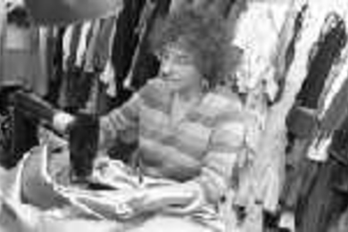 MIT costume designer Leslie Cocuzzo-Held sews costumes in her workshop.