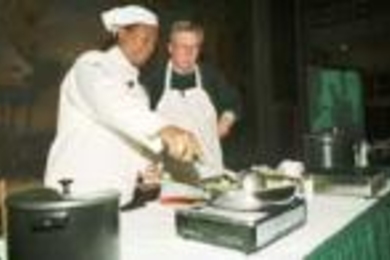 Dean for Graduate Students Ike Colbert (left) and Executive Vice President John Curry faced off last Friday night in the Iron Chefs Cookoff. Starting with the same basic ingredients, they concocted two very different dishes.