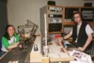 Former WMBR general manager Joyce C. Yang, a graduate student in biology (left) and current general manager Christopher Avrich, a senior in electrical engineering and computer science, work the boards in the radio station's studio.