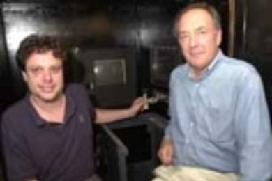 Graduate student Camillo Padoa-Schioppa (left) and Professor Emilio Bizzi studied monkeys' movements using the computer joystick that Padoa-Schioppa has his hand on.