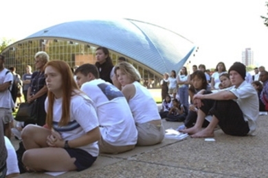 Students listen and reflect at the vigil on the steps of the Stratton Student Center Tuesday evening