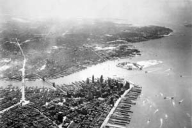 The Manhattan Bridge (left) and the Brooklyn Bridge link New York's two largest boroughs. The photograph of lower Manhattan was taken from about 3,000 feet in 1936.