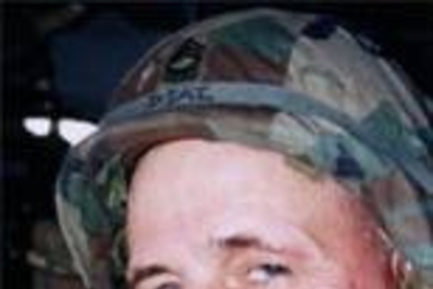 MIT Director of Safety Programs Jerry Diaz, a  registered nurse and a master sergeant in the Army, in a Black Hawk helicopter  in Kosovo.
