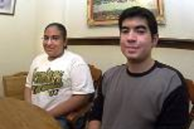 Melissa Gonzalez (left) poses with her brother Gabriel Gonzalez in their home north of Weslaco, Texas.  Melissa, the valedictorian at Edcouch-Elsa High School, will join her brother at MIT this fall.