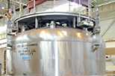 This 150-ton magnet in Japan is crucial to an international experiment on nuclear fusion (a cover is held above it, ready to be put in place for a test run). Image courtesy Japan Atomic Energy Research Institute