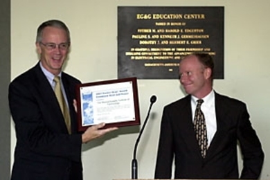 President Charles M. Vest (left) receives an award from Mike Kenyon of the U.S. Environmental Protection Agency and Department of Energy for increasing energy efficiency and reducing pollution at the William R. Dickson Cogeneration Facility.
