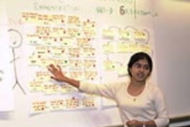 Electrical engineering and computer science sophomore Sumudu Watugala points to her notes during her UPOP presentation about optimizing the registration process for HASS-D courses.