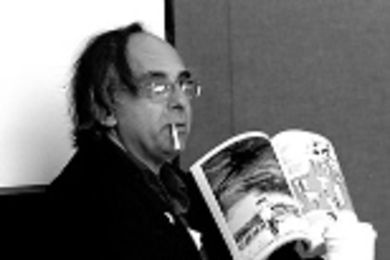 Art Spiegelman makes a point by holding up one of his comics at a special session for MIT cartoonists.