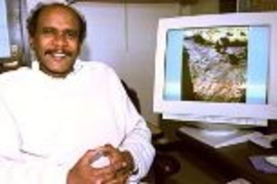 Professor Elfatih Eltahir of civil and environmental engineering sits by a monitor showing rock art of a giraffe carved thousands of years ago when portions of the Sahara were still green.ï¿½ï¿½ï¿½ï¿½ï¿½ï¿½