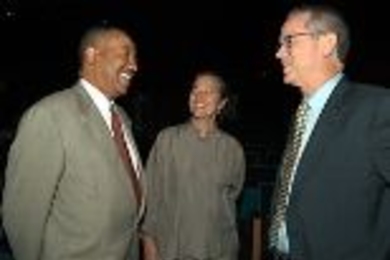 MIT News Office Director Arthur Jones (left) exchanges pleasantries with Vice President Kathryn A. Willmore and President Charles M. Vest at the freshman convocation on Aug. 25, 2003.