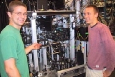 Tom Pasquini (left) and Aaron Leanhardt (right) in front of the machine where they and collaborators cooled a sodium gas to 500 picokelvin.