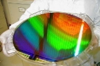 MIT's Nanoruler was used to create parallel lines and spaces only 400 billionths of a meter apart (the diameter of a human hair is about 250 times larger) across this silicon wafer. The wafer is 12 inches in diameter.