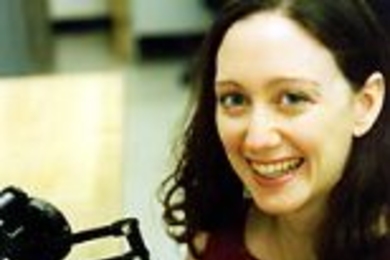 Sommer Gentry with the robotic arm she programmed to "dance" with her.