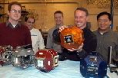 MIT aero/astro team members spent years building and testing these volleyball-sized satellites, and their work is about to pay off. Left to right: graduate students Dustin Berkovitz, Alvar Saenz-Otero and Mark Hilstad, Professor David Miller and research scientist Edmund Kong.