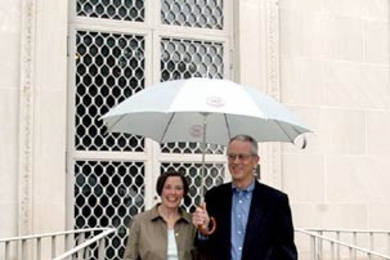 'At least there'll be three of us,' MIT President Charles Vest quipped to a photographer as he and his wife Rebecca left Gray House during a steady drizzle to attend the Sept. 18, 2004 community celebration in their honor at the Stata Center. In fact... <a onclick="MM_openBrWindow('1-vestparty-enlarged.html','','width=509, height=583')"><span onmouseover="this.className='cursorChange';">Open imag...