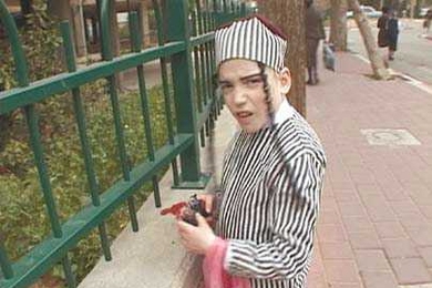 A still from the film "When Adar Enters" by Yael Bartana shows a young boy celebrating Purim.