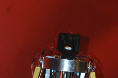 'Toddler,' a walking robot developed at MIT, takes a step.