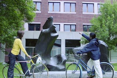 List Visual Arts Center Education and Outreach Coordinator Hiroko Kikuchi, right, points out the elements of Henry Moore's Reclining Figure at MIT to Anna Lovecchio last week. Kikuchi will be one of the leaders of the Art on Wheels campus tour on Wednesday, July 13.