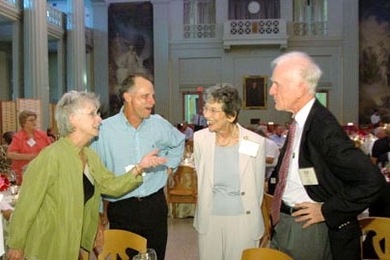 Barbara Peacock-Coady, far left, shares a story with her husband, Joe Coady, left, and Barbara Penfield, right, wife of Paul Penfield Jr, far right.
