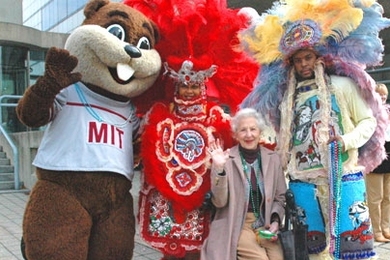 Catherine 'Kay' Stratton, 91, center, joins Tim the Beaver and two members of New Orleans jazz band the Wild Magnolias on Oct. 28. The band played for members of the Council for the Arts at MIT, which was holding its 33rd annual meeting.