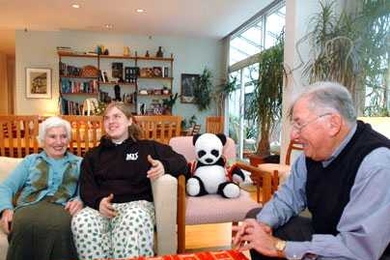 Genevieve Ricart, a brain and cognitive sciences senior who lives in Next, shares a light moment with housemasters Professor Borivoje 'Bora' Mikic of mechanical engineering, right, and his wife, Liba, left.